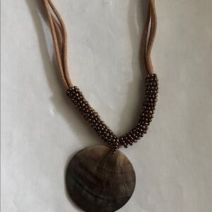 Lia Sophia Brown Necklace with Circular Shell Pendant and Earthy Tones